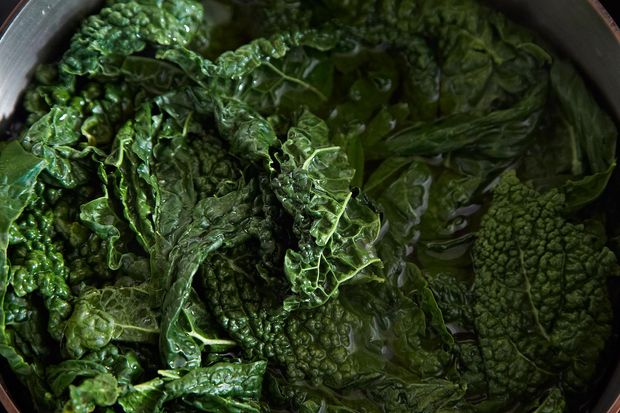 Slow-Cooked Tuscan Kale with Pancetta, Breadcrumbs, and a Poached Egg